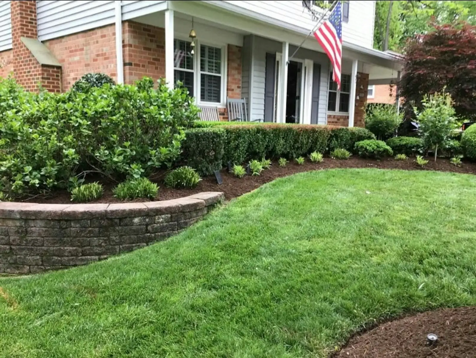 A house with a landscaped lawn